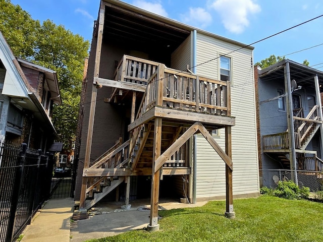 rear view of house with a yard