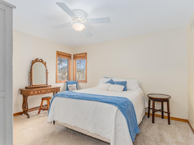 bedroom with light carpet and ceiling fan