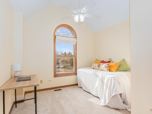 carpeted bedroom featuring lofted ceiling and ceiling fan