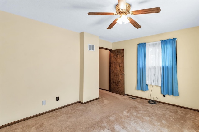 carpeted empty room with ceiling fan