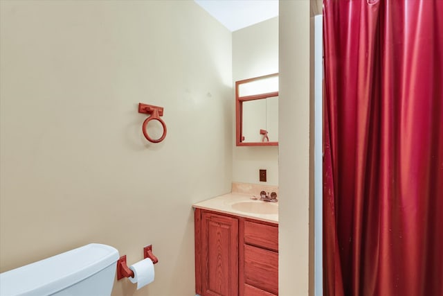 bathroom with toilet and vanity