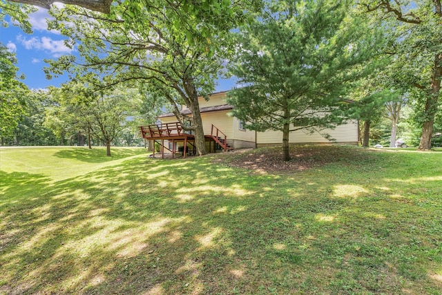 view of yard with a deck