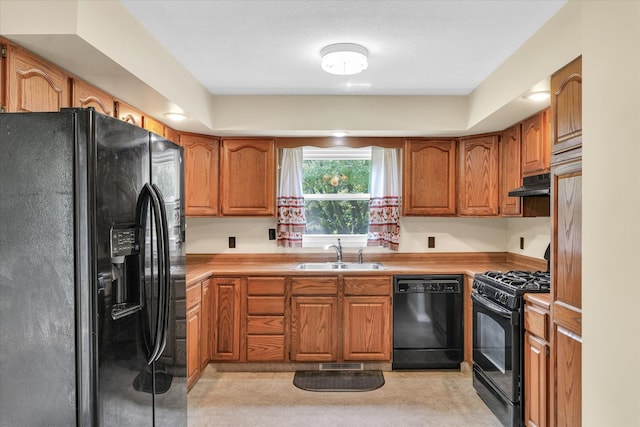 kitchen with sink and black appliances