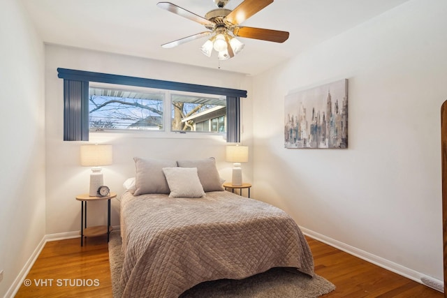 bedroom featuring ceiling fan and hardwood / wood-style floors