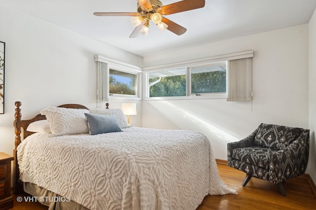 bedroom featuring ceiling fan and wood-type flooring