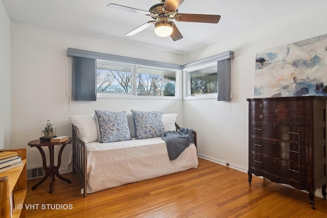 bedroom featuring hardwood / wood-style flooring and ceiling fan