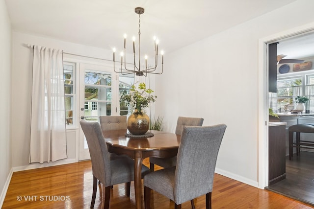 dining area with a chandelier and hardwood / wood-style floors