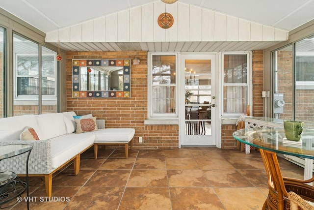 sunroom / solarium with lofted ceiling