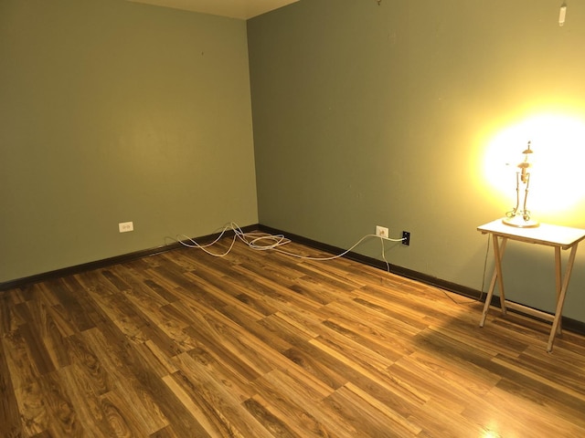 spare room featuring hardwood / wood-style flooring