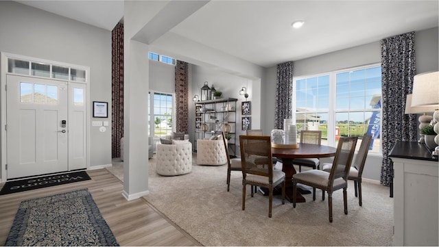 dining space with light hardwood / wood-style flooring