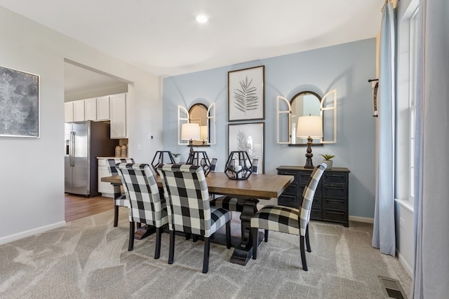 view of carpeted dining area