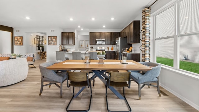 dining room featuring light wood-type flooring