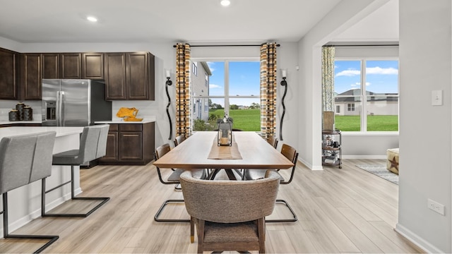 dining area with light hardwood / wood-style flooring