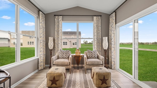 sunroom / solarium featuring lofted ceiling