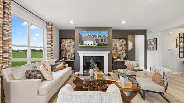 living room with light hardwood / wood-style floors