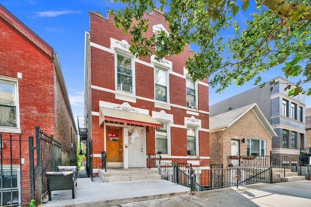 view of property with fence and brick siding