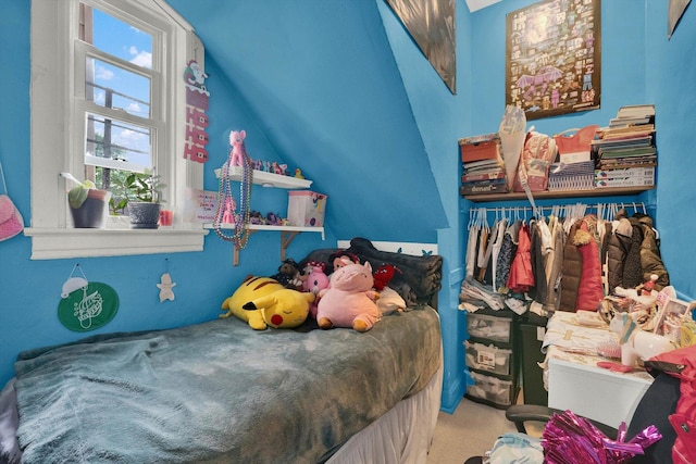 bedroom with lofted ceiling