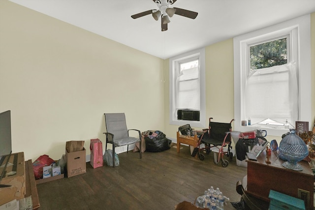 misc room featuring dark wood-type flooring, a wealth of natural light, cooling unit, and ceiling fan