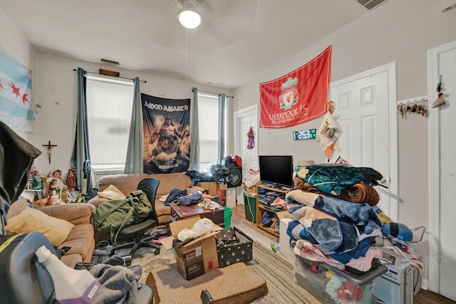 bedroom featuring cooling unit and a ceiling fan