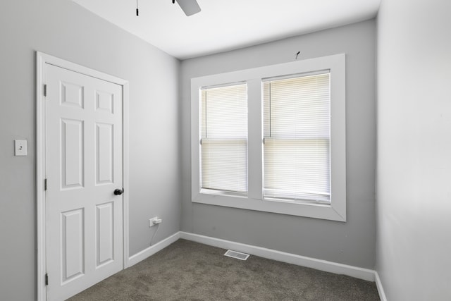 carpeted empty room with ceiling fan