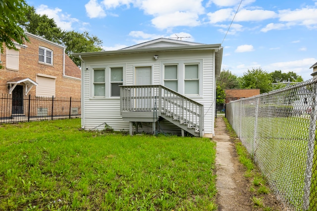 rear view of house with a lawn