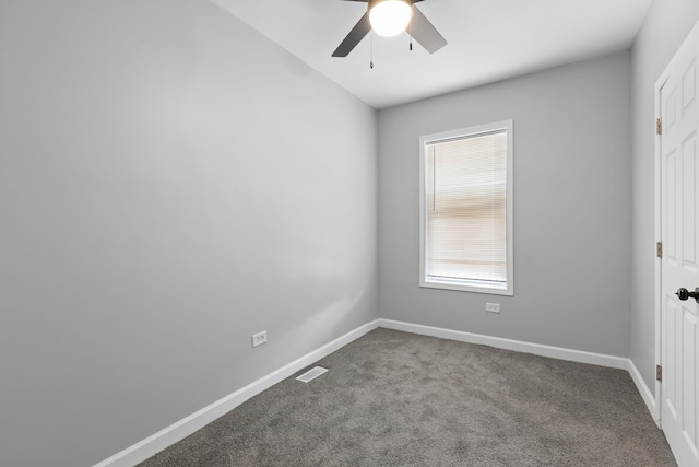 interior space with carpet flooring and ceiling fan