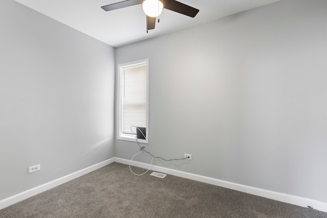 empty room featuring carpet flooring and ceiling fan