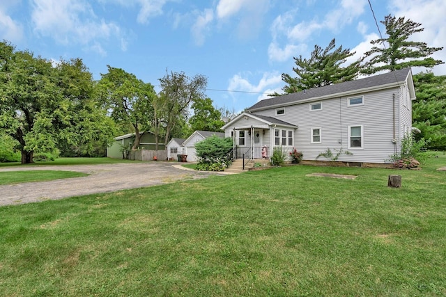 colonial-style house with a front yard and driveway