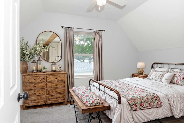 carpeted bedroom with vaulted ceiling and ceiling fan