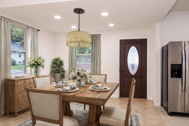 dining space featuring light tile patterned floors