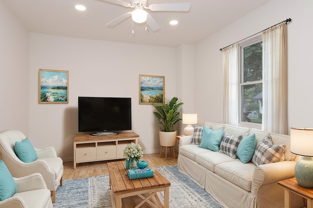 living room featuring light hardwood / wood-style floors and ceiling fan