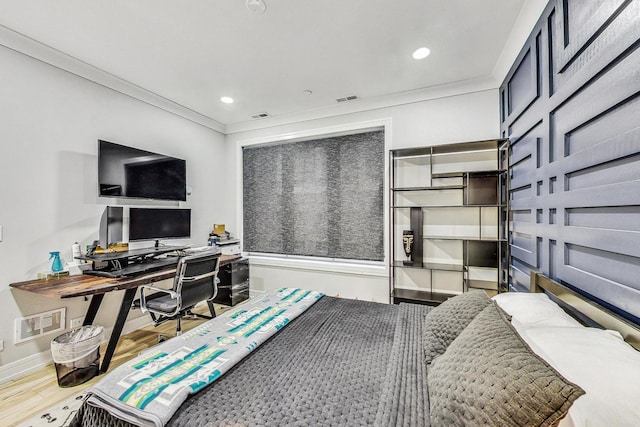 bedroom featuring crown molding and hardwood / wood-style flooring