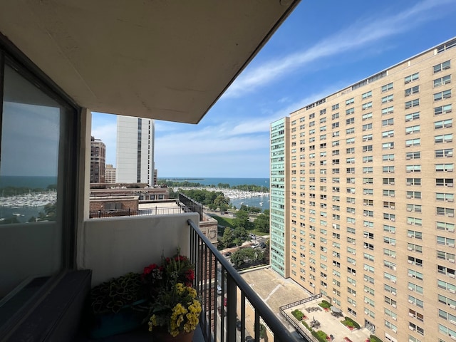 balcony featuring a water view