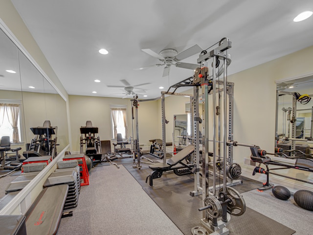 exercise room with carpet flooring and ceiling fan