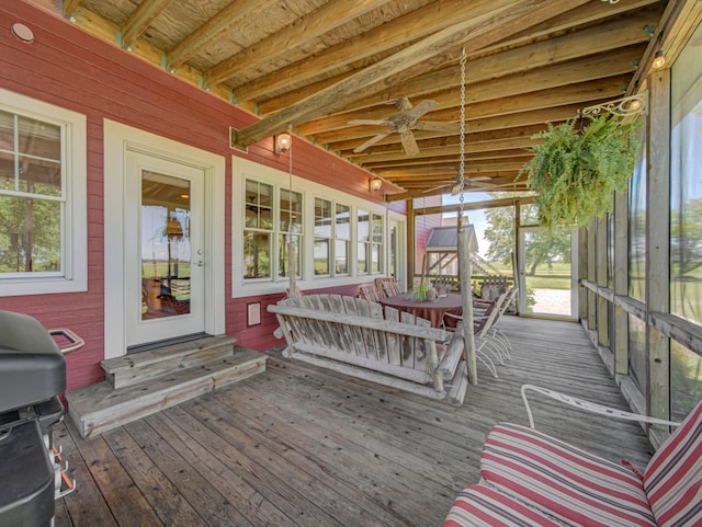 wooden deck featuring area for grilling and ceiling fan