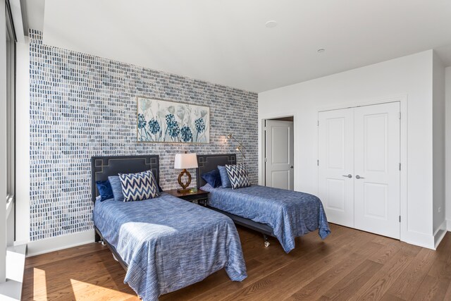 bedroom with a closet and wood-type flooring