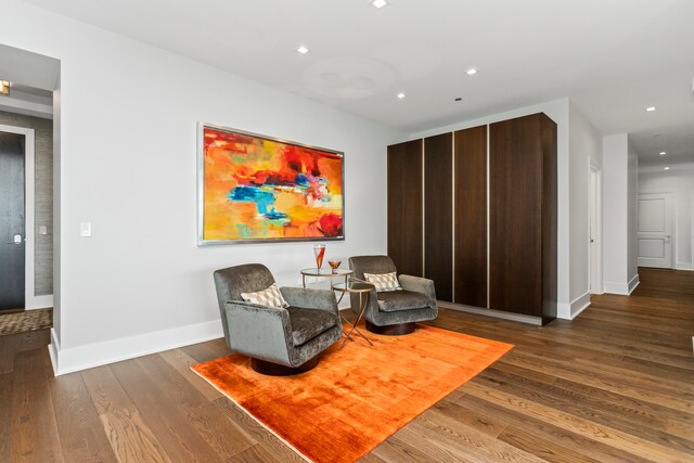 living area with dark hardwood / wood-style floors