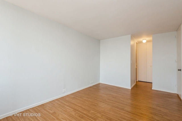 unfurnished room with light hardwood / wood-style floors