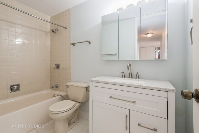 full bathroom with tile patterned flooring, vanity, toilet, and tiled shower / bath