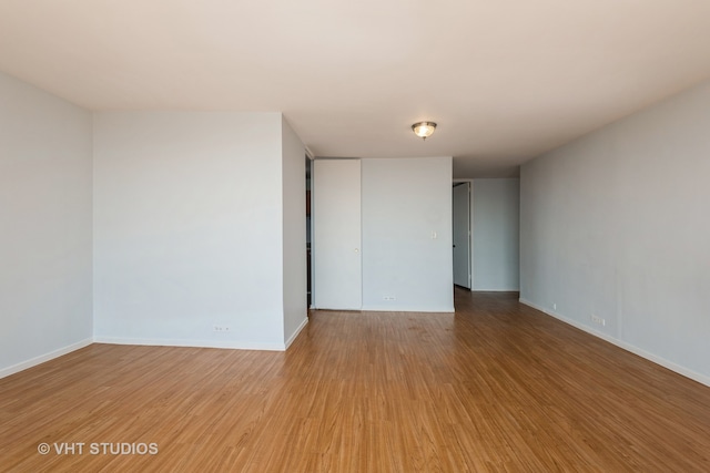 empty room featuring wood-type flooring