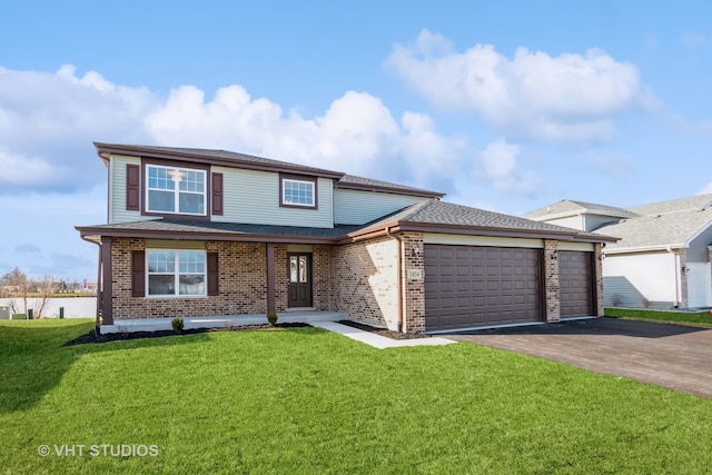 front of property with a front yard and a garage