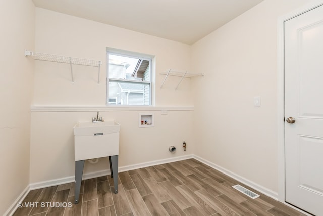 laundry area with wood-type flooring and washer hookup