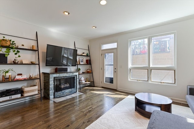 living room featuring ornamental molding and dark hardwood / wood-style floors