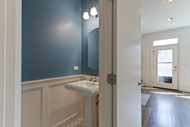 bathroom with wood-type flooring