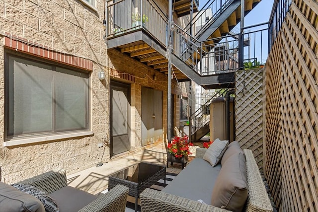 view of patio / terrace featuring an outdoor living space and a balcony