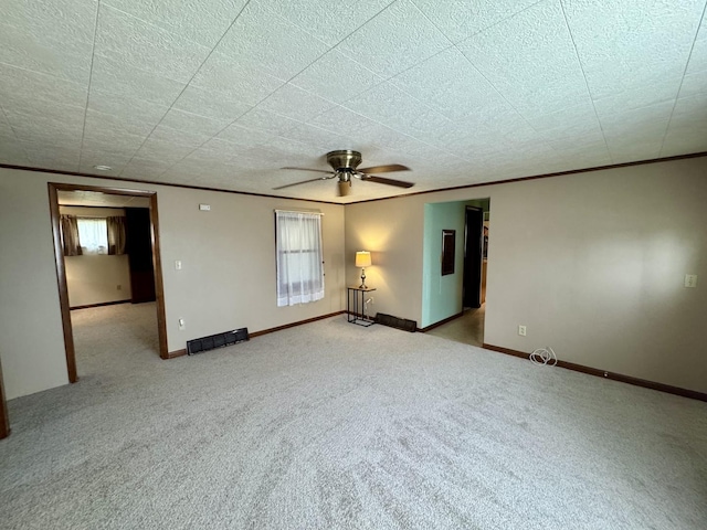 321 E N St, Sheffield, IL 61361 - carpeted empty room featuring ornamental molding, ceiling fan, and baseboards