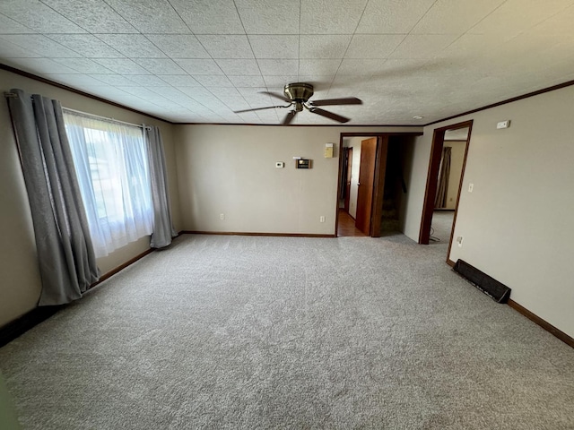 321 E N St, Sheffield, IL 61361 - empty room featuring carpet, a ceiling fan, crown molding, and baseboards