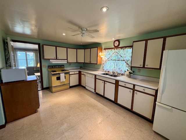 321 E N St, Sheffield, IL 61361 - kitchen with white appliances, under cabinet range hood, light countertops, ceiling fan, and a sink