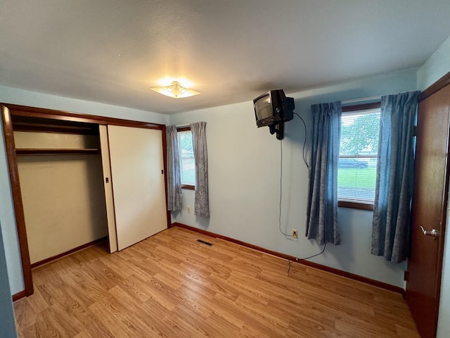 321 E N St, Sheffield, IL 61361 - unfurnished bedroom with light wood-style floors, a closet, and baseboards