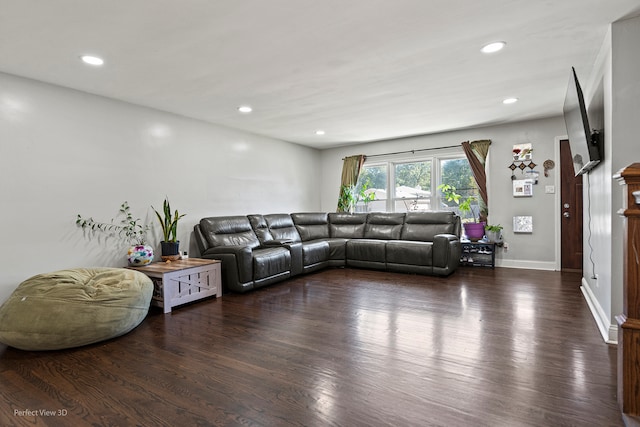 kitchen with light parquet floors, a center island, pendant lighting, and stainless steel appliances